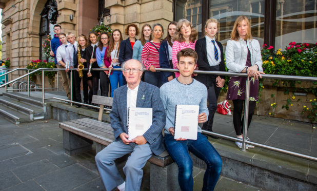 Protesting over tuition fees in 2018: At the front with the petitions are Alister Allan (left, first leader of Perth Youth Orchestra)  and Nicholas Baughan (right, current leader of Perth Youth Orchestra).