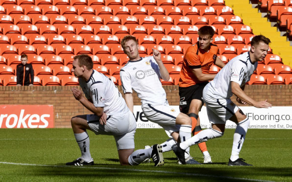 Matty Smith opens the scoring for United.