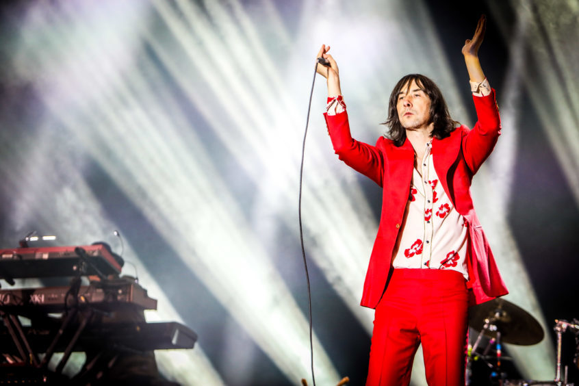 Bobby Gillespie of Primal Scream on stage.