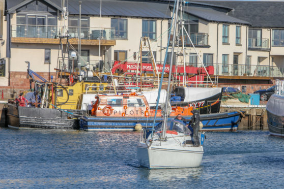 A yacht being returned to Arbroath harbour.