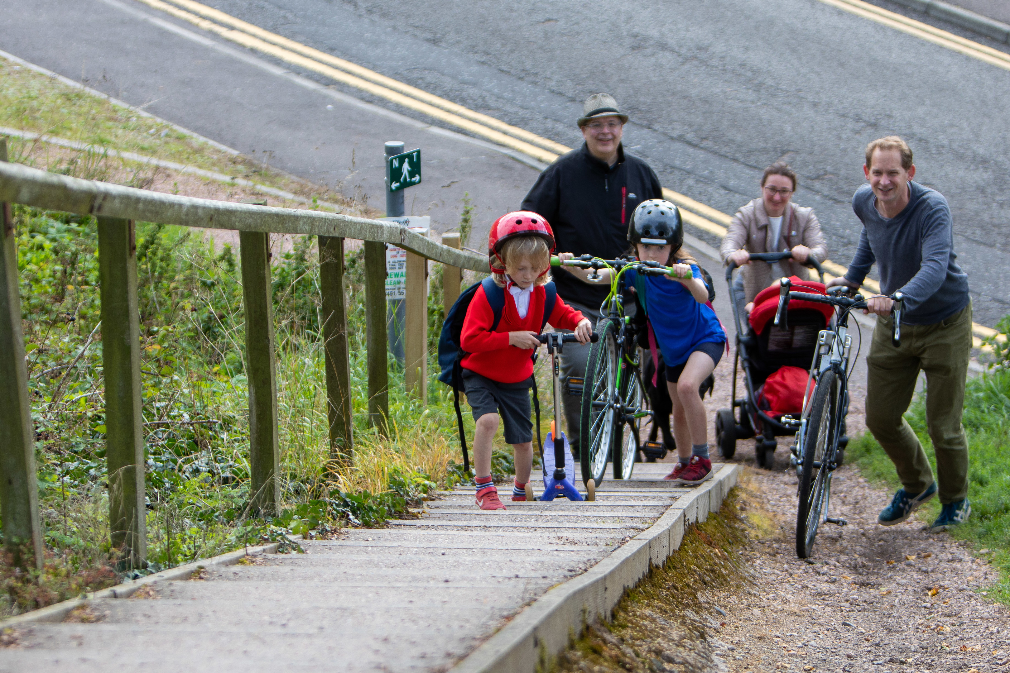 Laurie Finney (6), Freya Finney (9) and Alan Marshall (39) followed by Cllr Jonny Tepp and Nissa Finney (40) attempting a sectrion of the cycle path subject to a feasability study now funding has been approved.