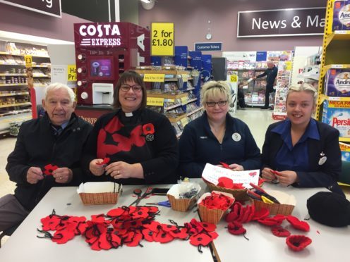 Making poppies at the Forfar Tesco store are, from left, Mike Smith of the Forfar Branch of the Royal Air Forces Association, the Rev Maggie Hunt, Lyn Archer and Kerri Myles.