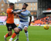 Morton's Rory McKeown gets to grips with Dundee United's Fraser Aird.