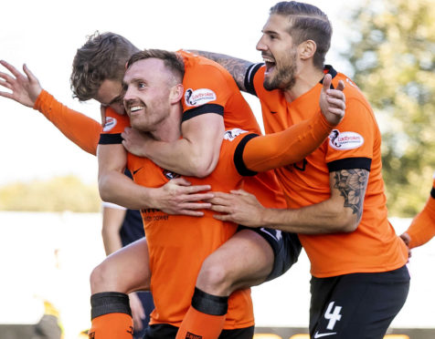 Dundee United players celebrate