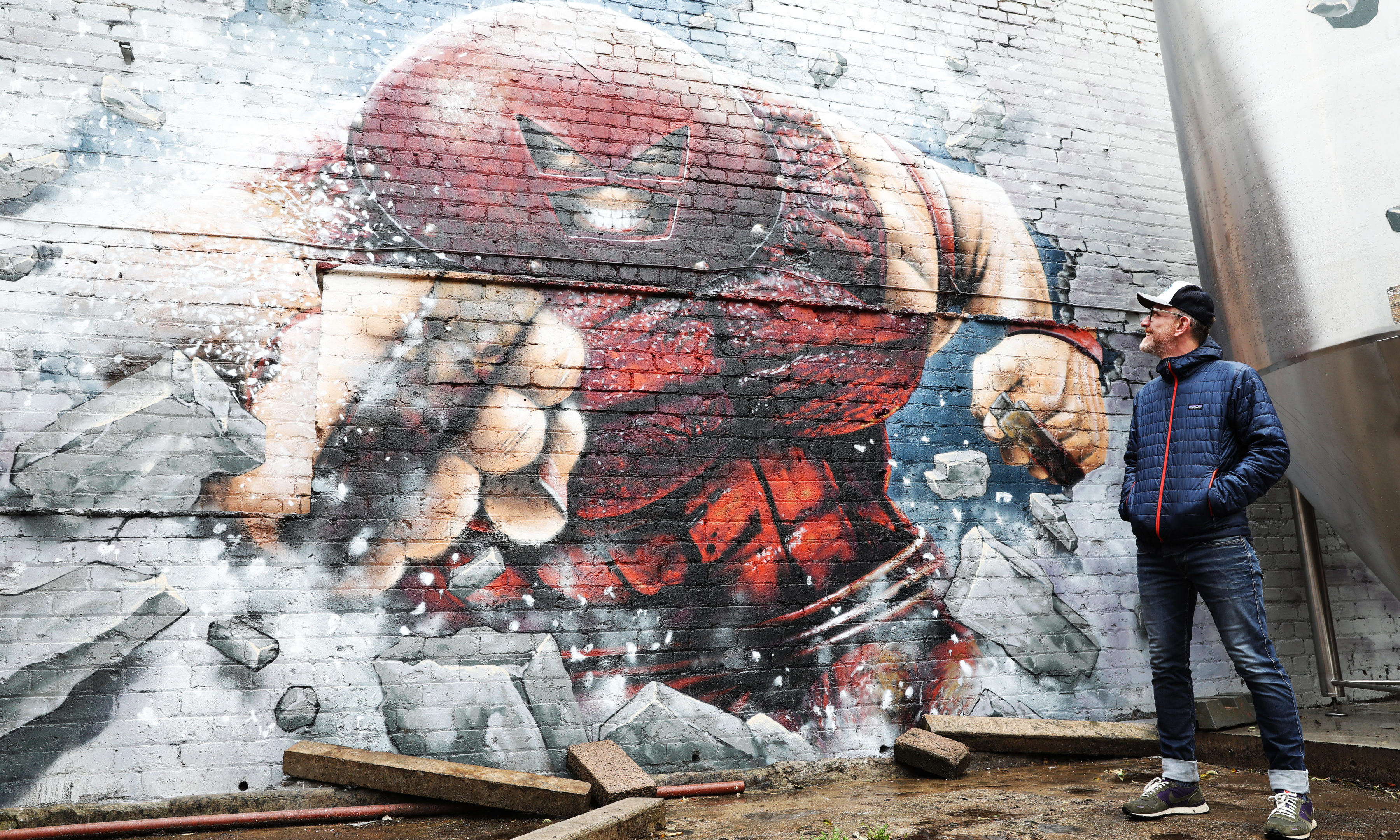 71 Brewing's Duncan Alexander with the Juggernaut mural.