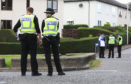 Emergency services at the scene of a bomb scare in Dundee on Carlochie Place.