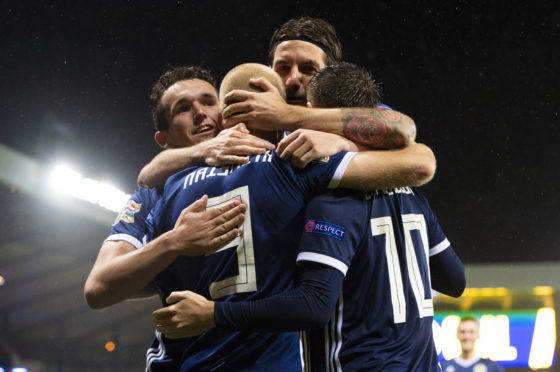 Scotland players celebrate their opening goal.