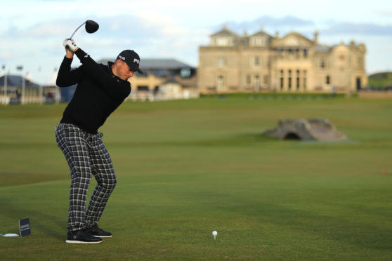Matt Wallace recorded a birdie on the last on the Old Course to share the lead in the Dunhill Links.