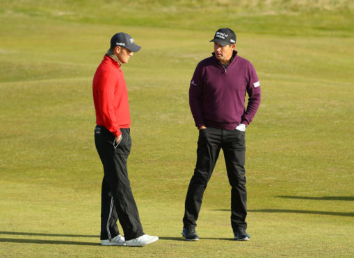 Padraig Harrington speaks with Martin Kaymer at Carnoustie yesterday.