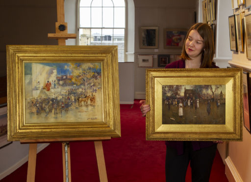 Carly Shearer of  Lyon & Turnbull holding James Watterston Herald's painting entitled 'Sunday Morning' with 'The Travelling Theatre, Buffalo Bill at Arbroath' on the left.