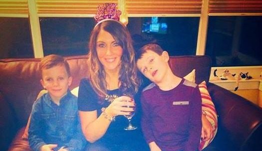 Arlene alongside her two boys.