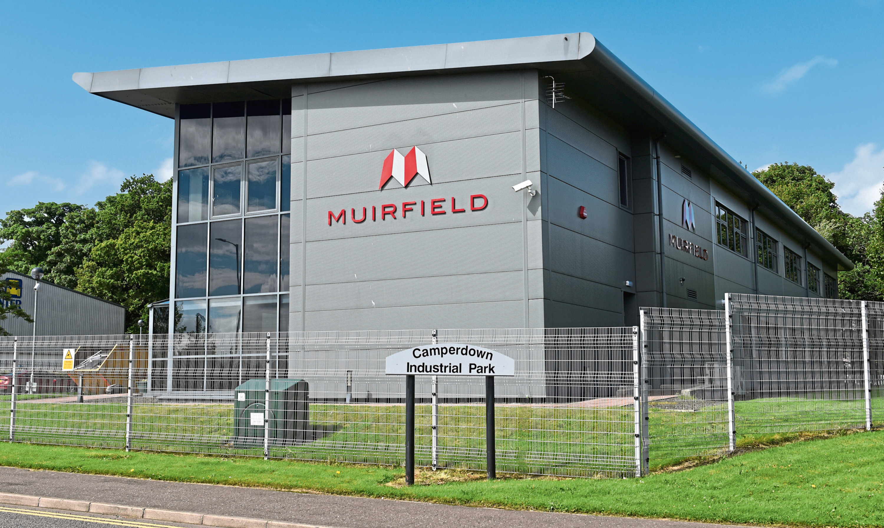 21.07.15 - pictured is the former Muirfield Contracts HQ, George Buckman Drive, Camperdown Industrial Park, Dundee where there is activity emptying some of the contecnts into a skip