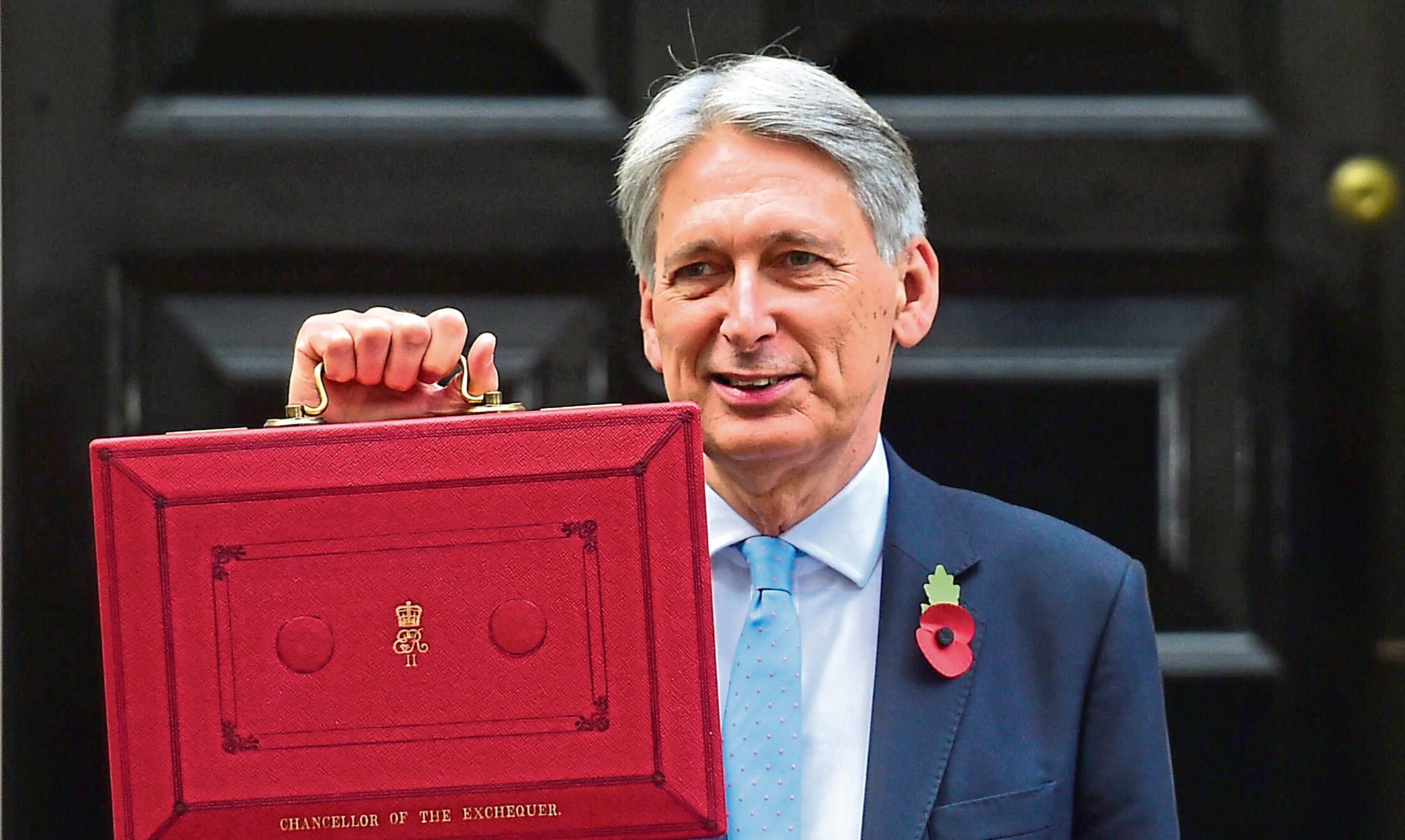 Chancellor Philip Hammond holding his red ministerial box before delivering the Budget.