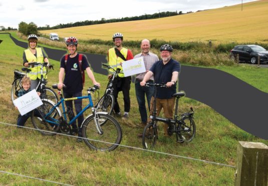 Supporters of the project on part of the proposed route near St Andrews.