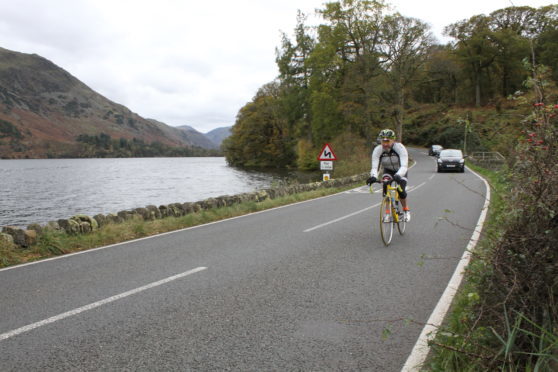 Cyclists often ride further out in the lane to make themselves visible.