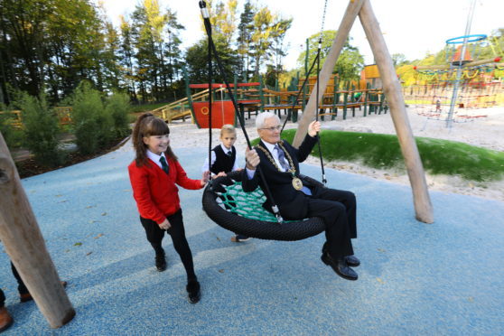 School children with Lord Provost Ian Borthwick at the opening of the new play park