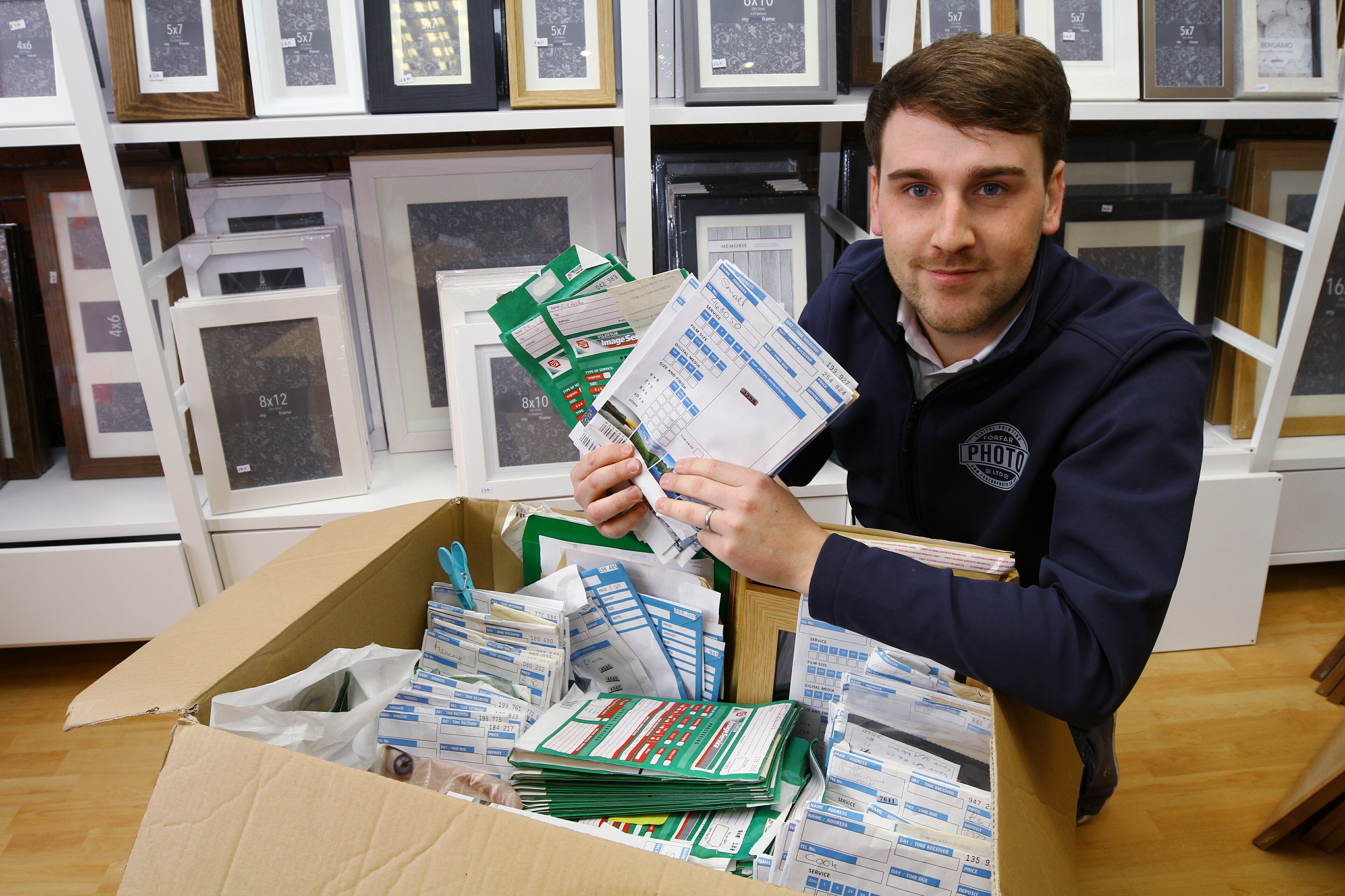 Chris Simpson has dozens of unclaimed photo orders in his Forfar shop
