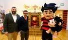 Billy Gartley - head of cultural services at Leisure and Culture DCC, and Mike Stirling - head of Beano Studios, with Dennis and Gnasher.
