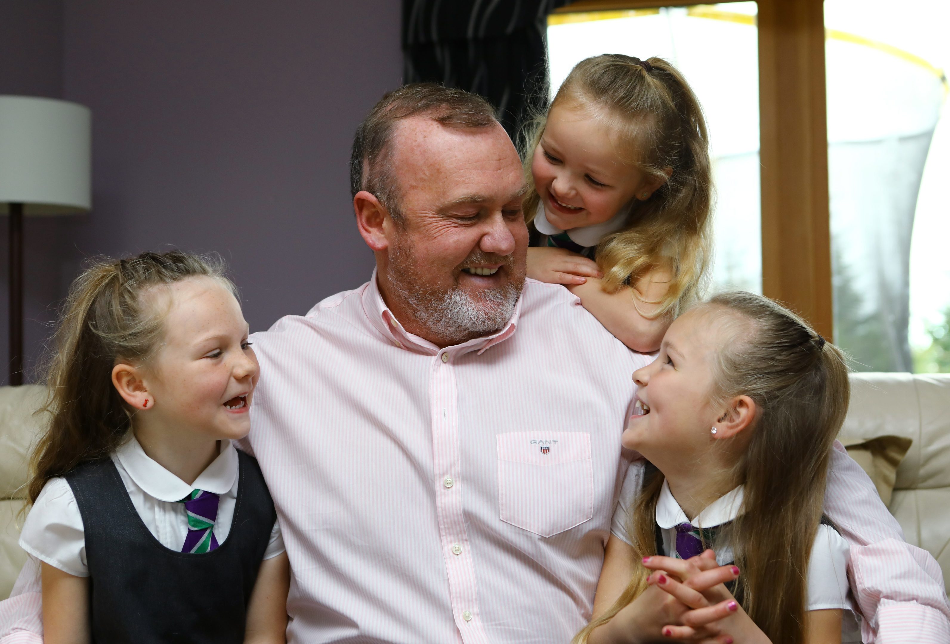 Piperdam man Derek Tomnay, who has a brain tumour, with his three youngest daughters