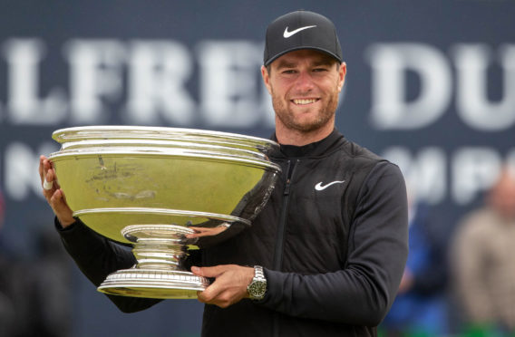 Luca Bjerregaard with the Alfred Dunhill Links Championship Trophy.