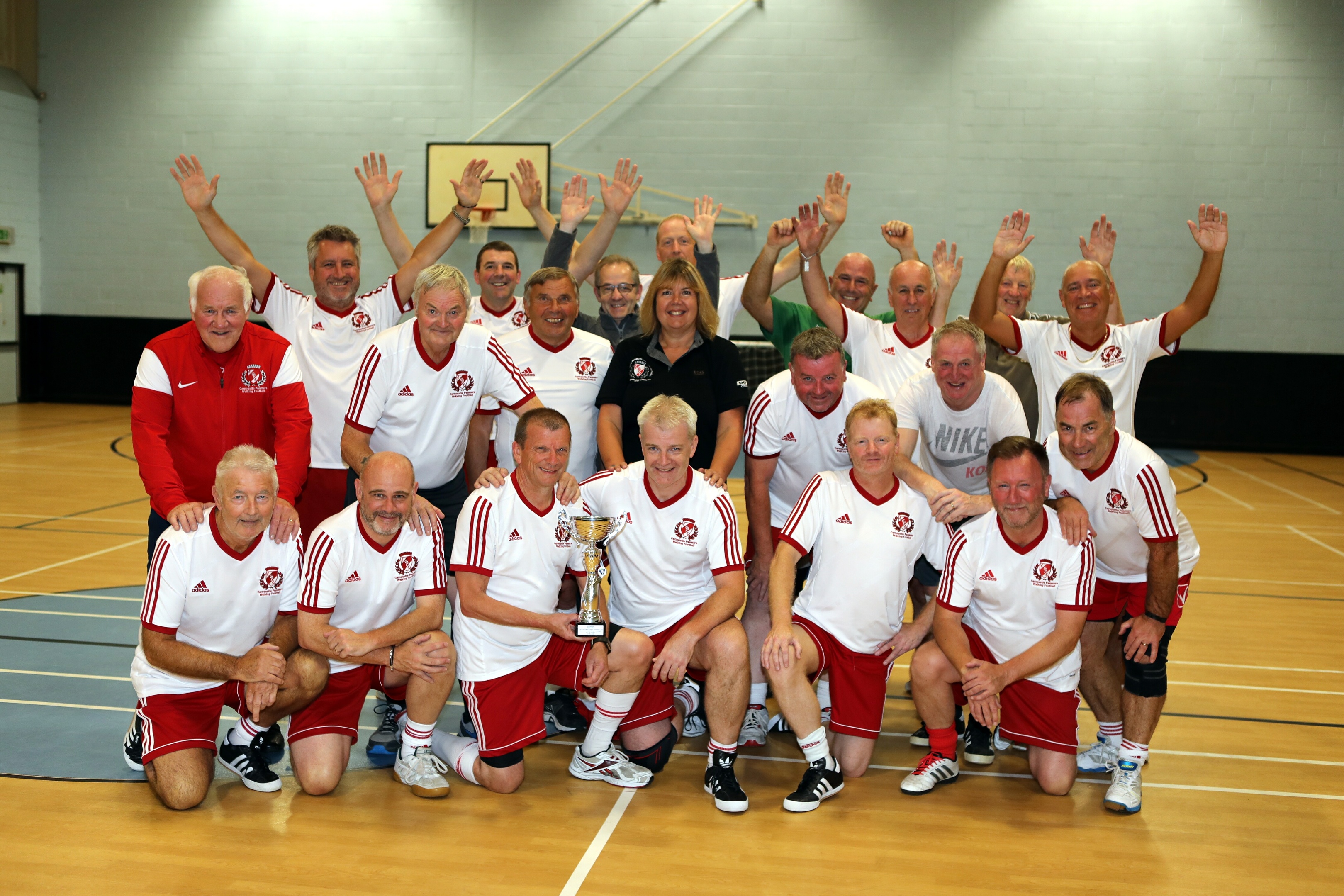 The walking footballers celebrating their success in Portugal.