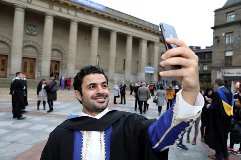 Abd Etbiga, 25 from Libia marks his finance degree with a selfie.