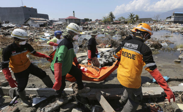 An Indonesian rescue team carries the body of a victim following an earthquake and tsunami in Palu, Central Sulawesi, Indonesia, earlier this month.