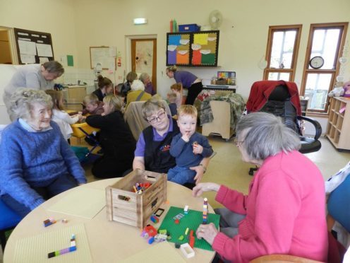 Service users and children at play.