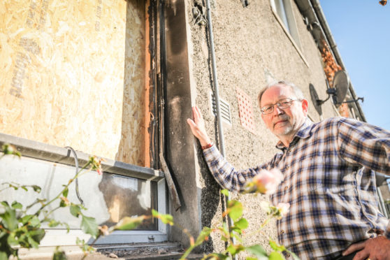 Cllr Tim Brett said the delay in repairing the fire-damaged flat was unacceptable