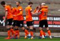 The United players celebrate Paul McMullan's opening goal.