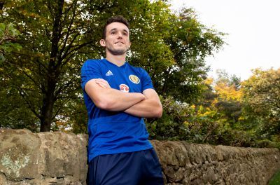 John McGinn relaxes after training.