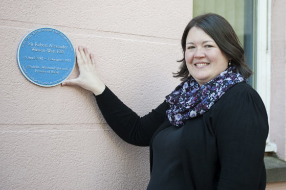 Deputy head teacher Sioehan Brown shows the plaque unveiled in memory of Robert Watson Watt.