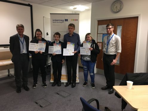 Angus Council strategic director Mark Armstrong with Saltire Award recipients Caitlin Milne, Cameron Graham, Thomas Reeves, Courtney Wilson and Councillor Ben Lawrie.