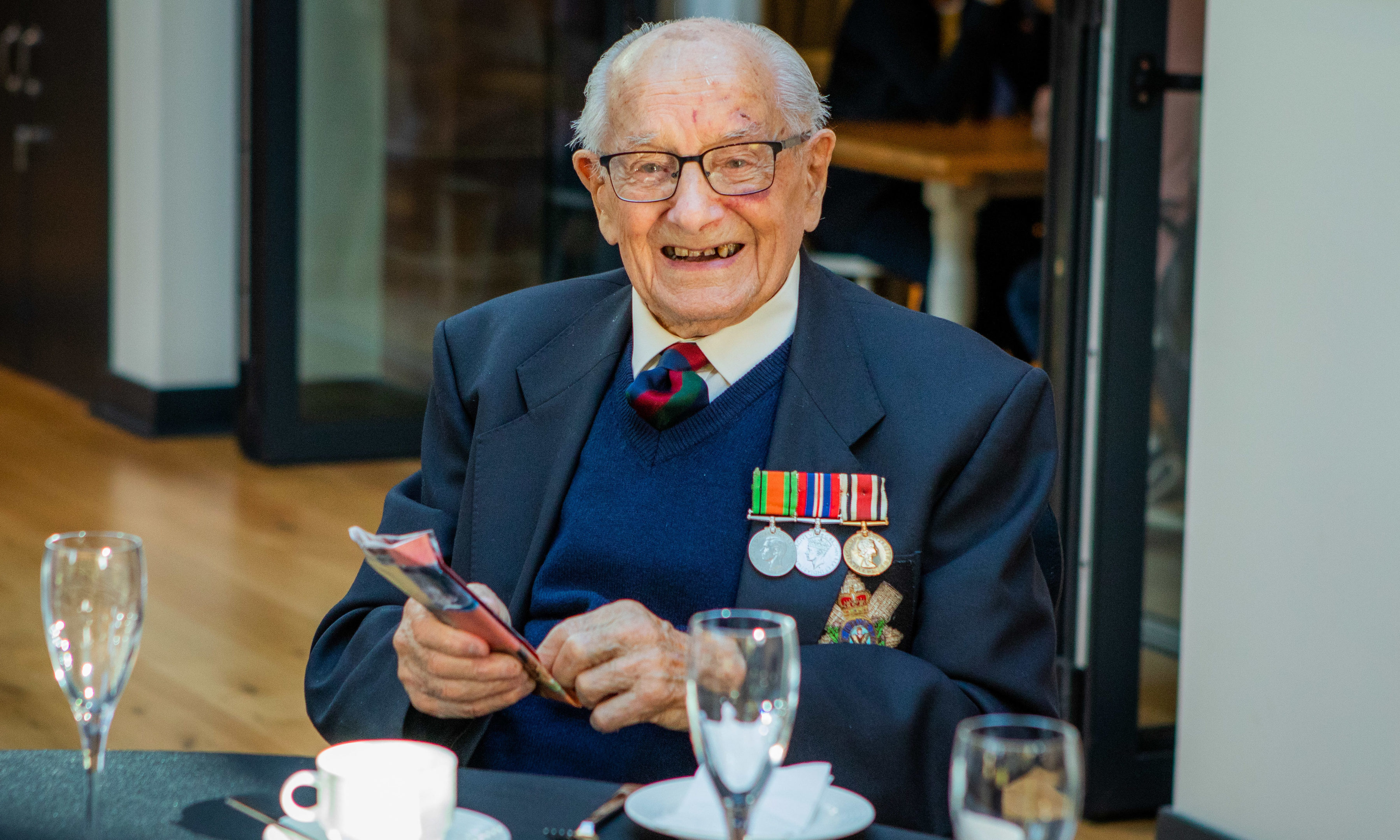 Georgie Reid celebrating his 100th birthday at The Black Watch museum