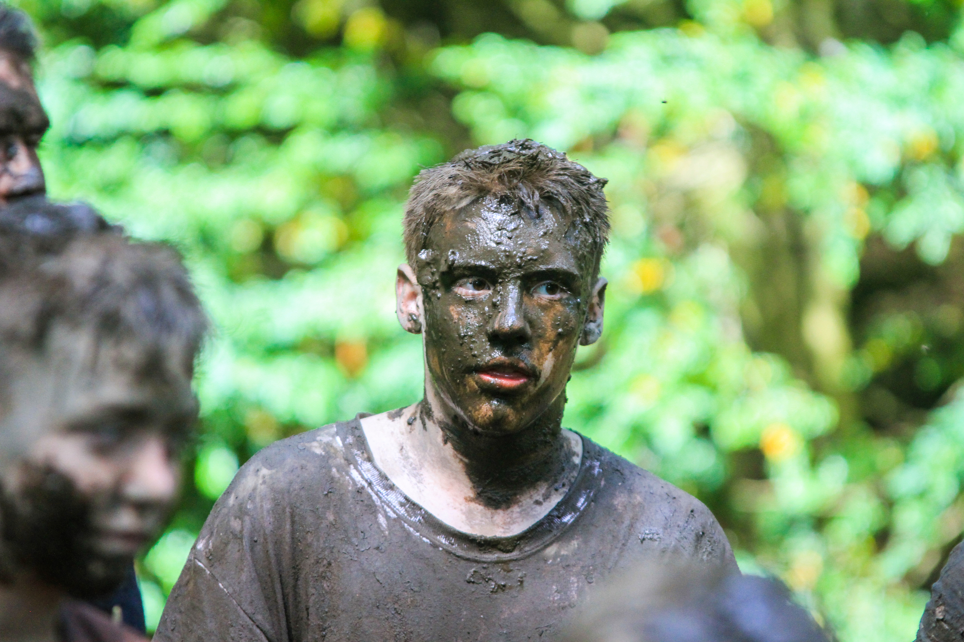 A Scout taking part in the mud ritual at the Blair Atholl Jamborette, an international scouting event.