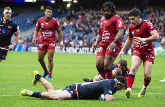 Captain Stuart McInally goes over for Edinburgh's third try.