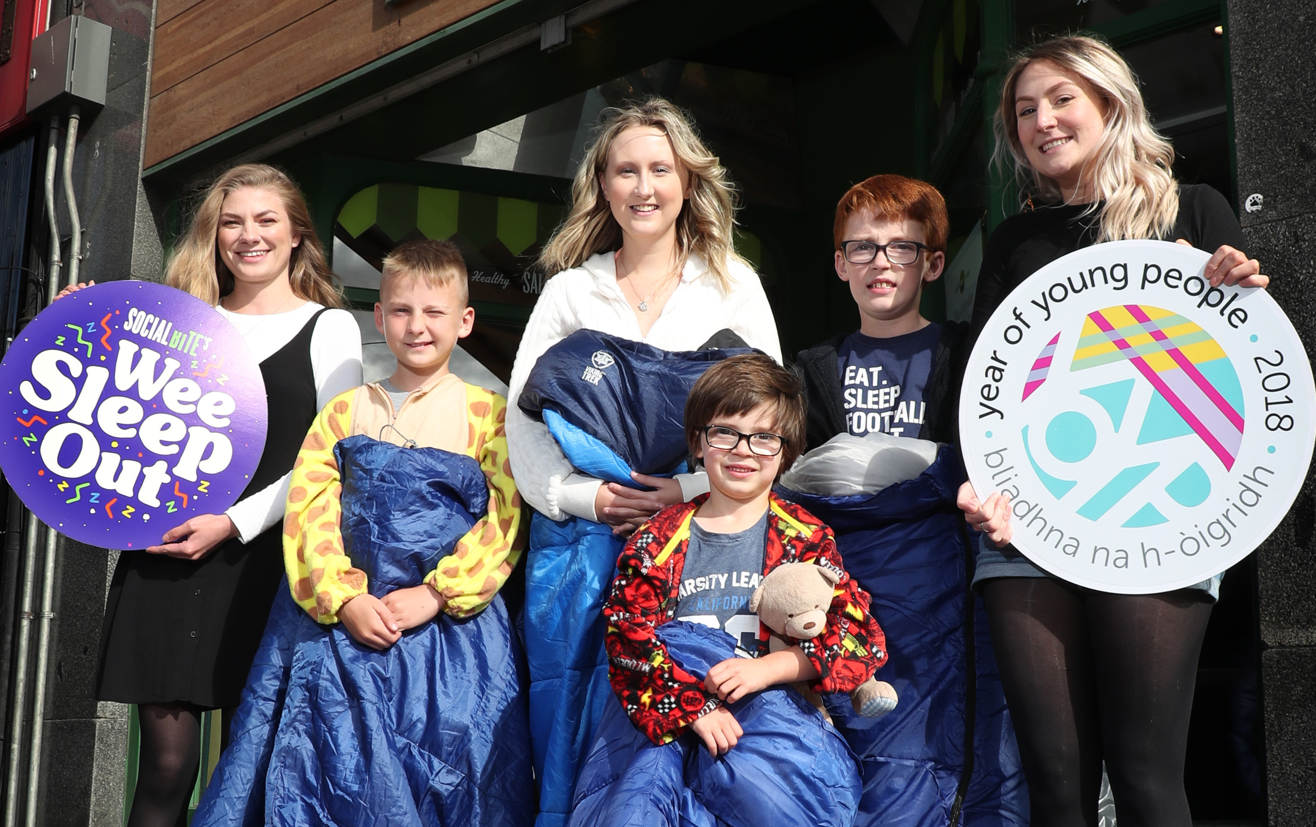 Alice Thompson, co-founder of Social Bite and organiser of the Wee Sleep Out, with fellow staff and a group of kids who are getting on board the project.