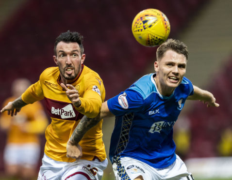 Jason Kerr battles with Motherwell's Ryan Bowman.