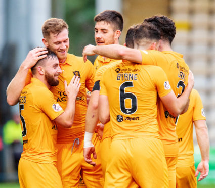 Livingston celebrate one of their four goals against Dundee.