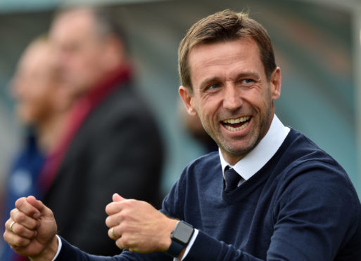 Neil McCann was a happy man on Saturday.