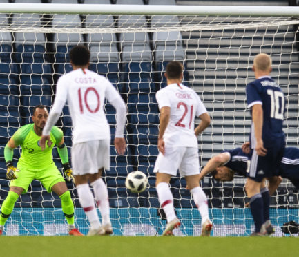 Scott McKenna misses the target with his diving header.