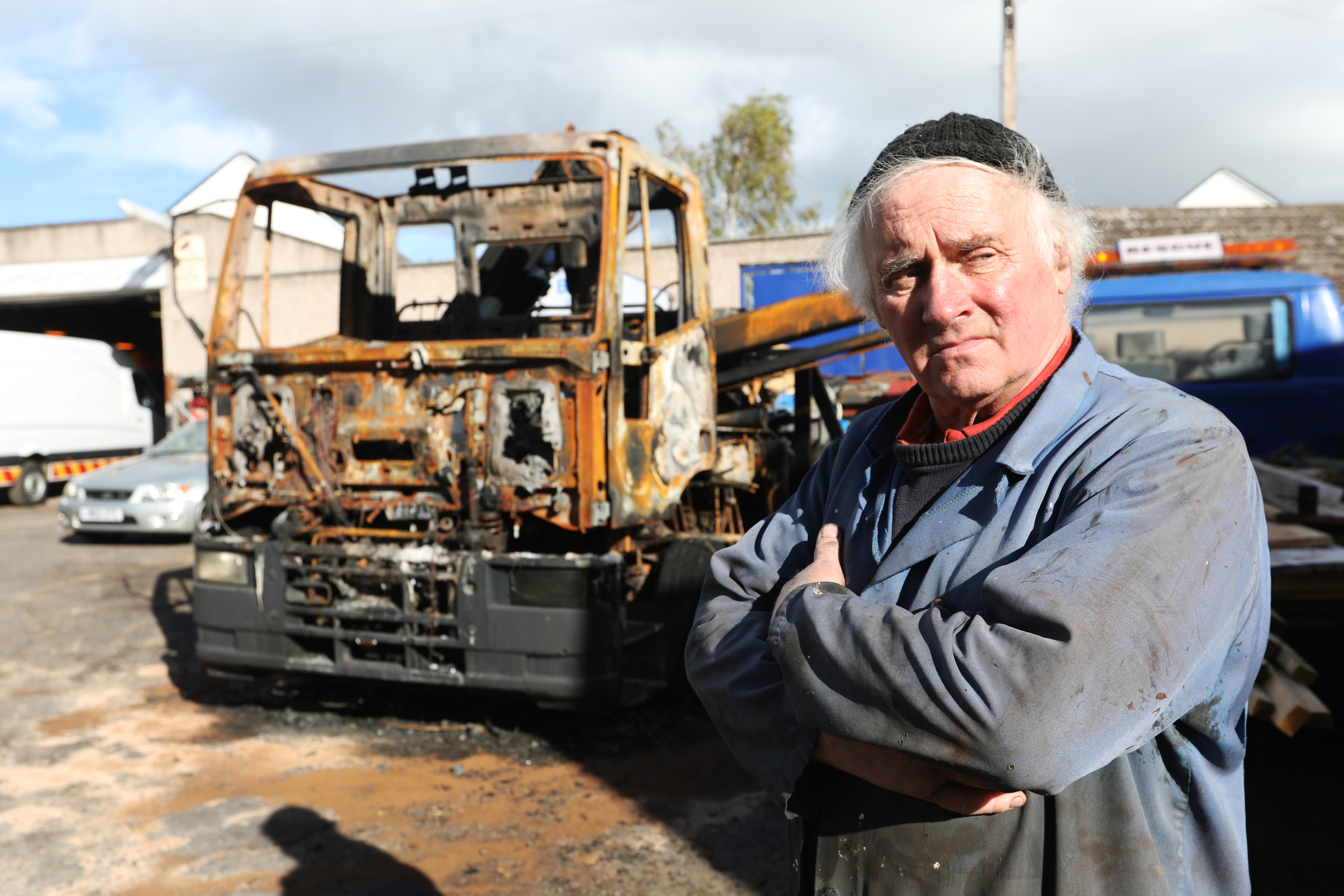 Owner of Bolts garage Bob Coote with the burnt out recovery truck.