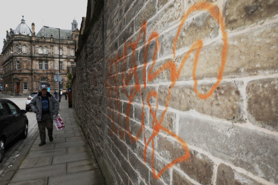 The outer wall of the medieval Howff on Barrack Street was damaged by yobs in October