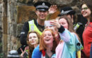 Students take a selfie with the police
