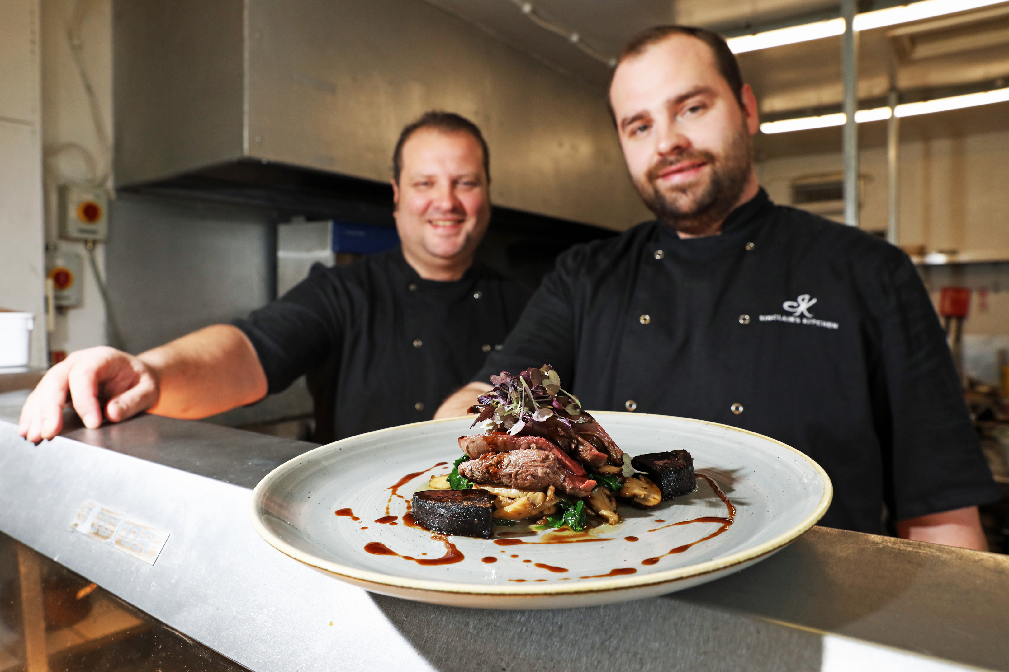 Eden Sinclair and head chef Jordan Sinclair with their dish of wood pigeon, wild mushroom, black pudding and red currant jus.