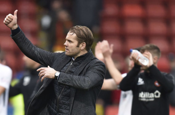 Robbie Neilson gives the United fans the thumbs-up.