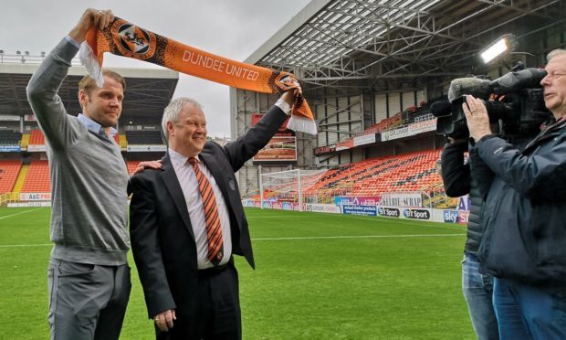 Dundee United chairman Mike Martin parades new manager Robbie Neilson in front of the media at Tannadice Park.