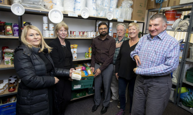 Rizwan Rafik welcomes politicians at a recent event at the TBM foodbank