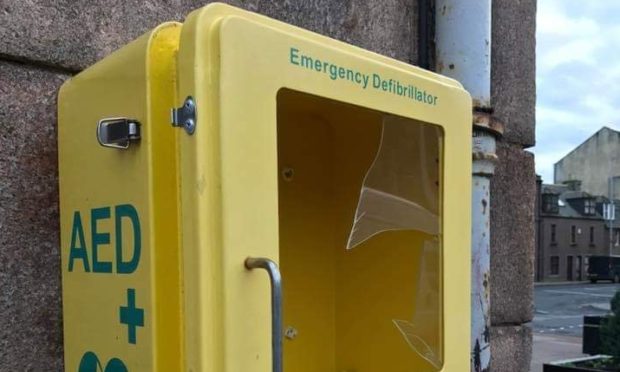 The damaged defibrillator cabinet