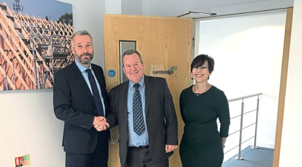 Donaldson Timber Engineering managing director Jonathan Fellingham with Cambridge Roof Truss managing director Jack McMinn and director Sue Mills.